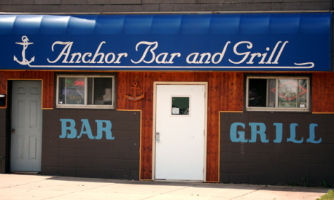 front of restaurant with blue awning that reads Anchor Bar & Grill